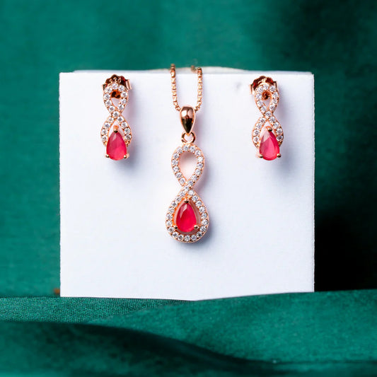 ROSE GOLD PLATED RUBY RED STONE & INFINITY CUBIC ZIRCONIA PENDANT SET
