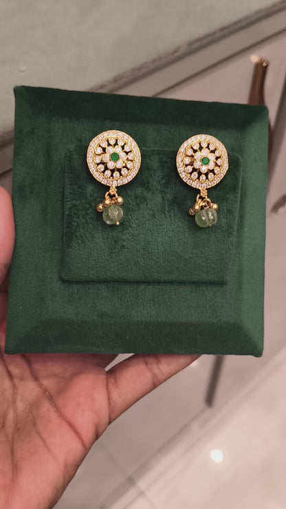 CHAITRA CZ FLORAL DESIGN EAR STUDS WITH EMERALDS